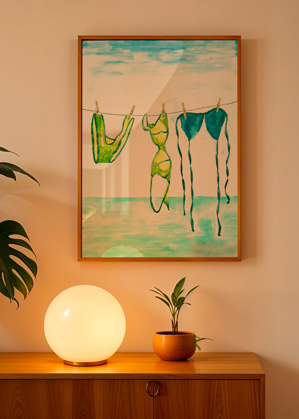 Illustration of hanging bikinis by the sea