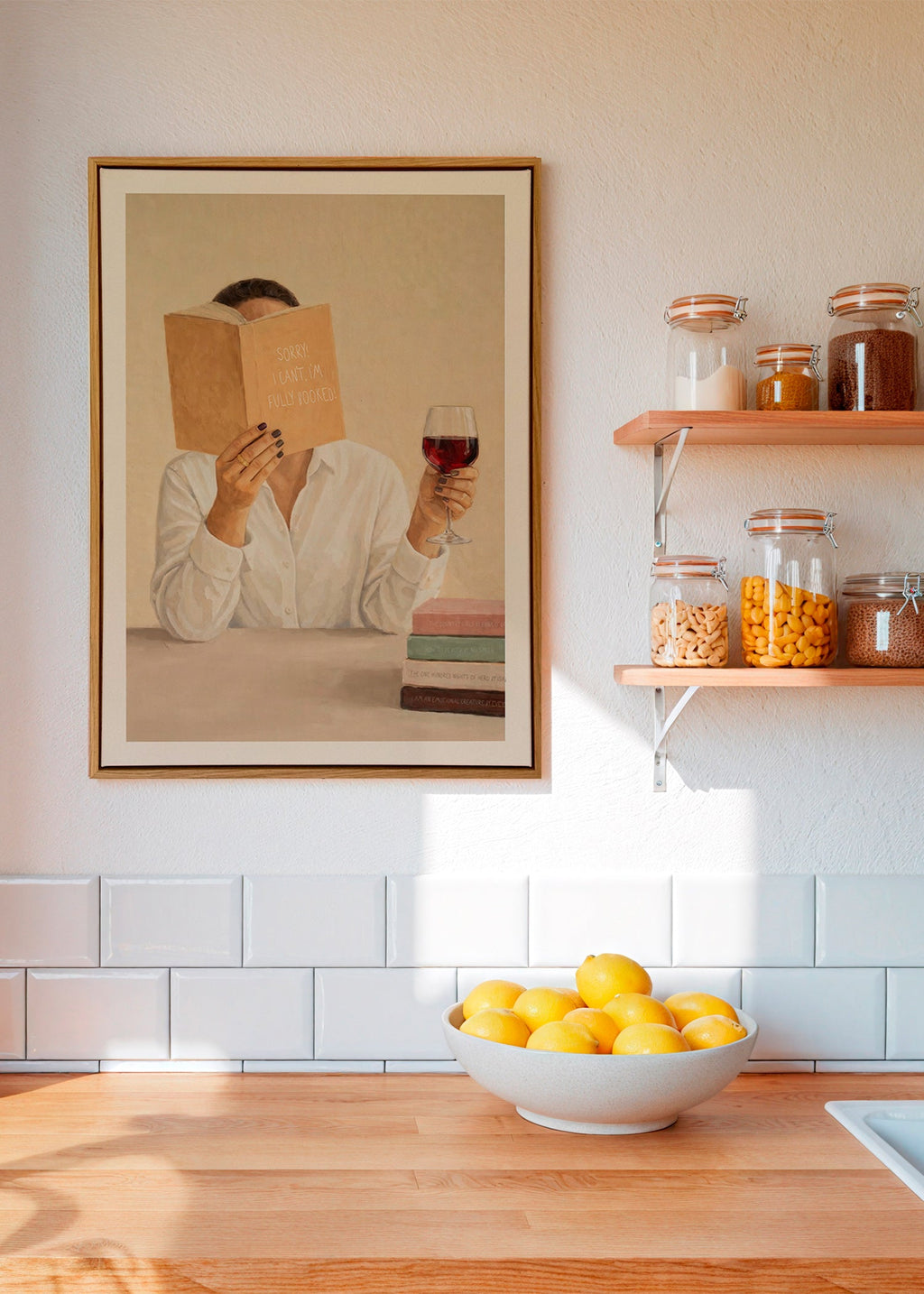 Kitchen art: woman reading with a glass of wine