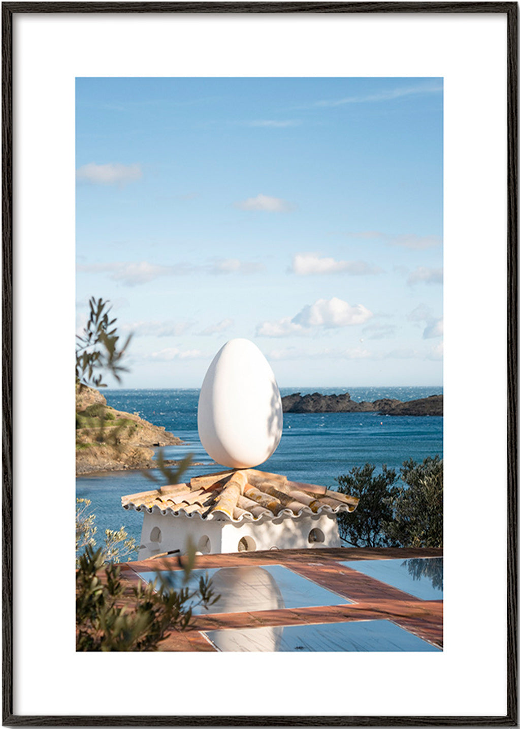 Landscape art with sculptural egg by the sea