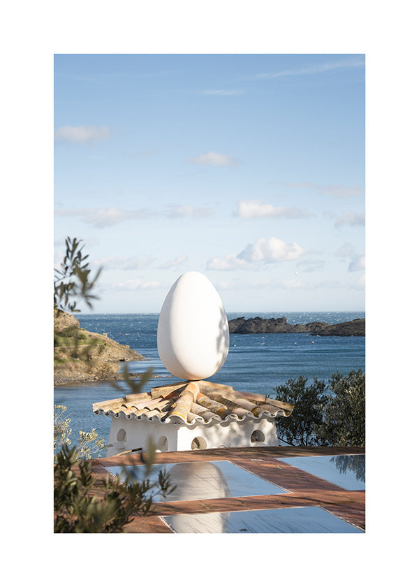 Landscape art with sculptural egg by the sea