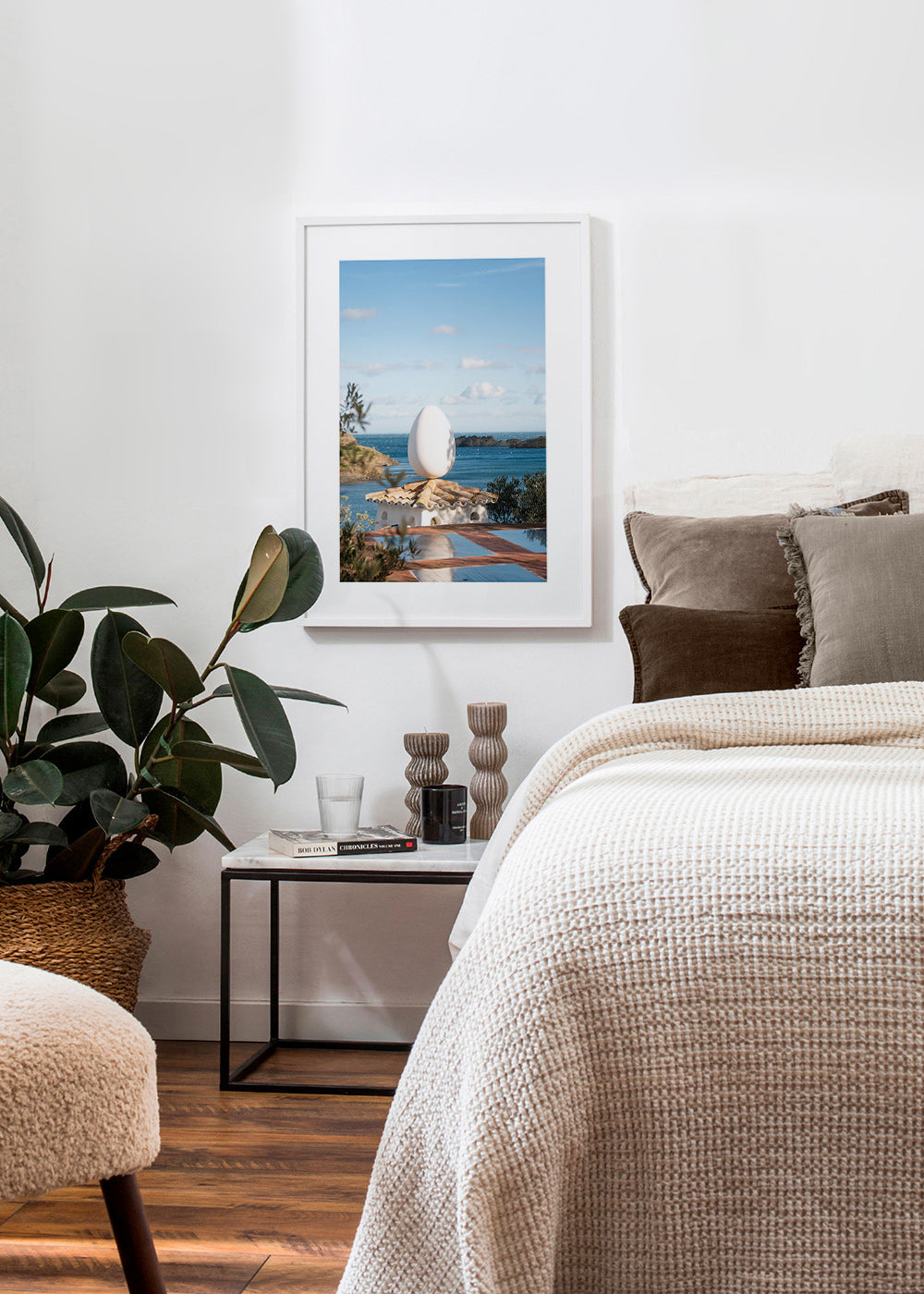 Landscape art with sculptural egg by the sea
