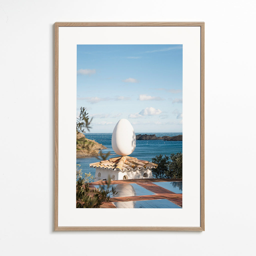 Landscape art with sculptural egg by the sea