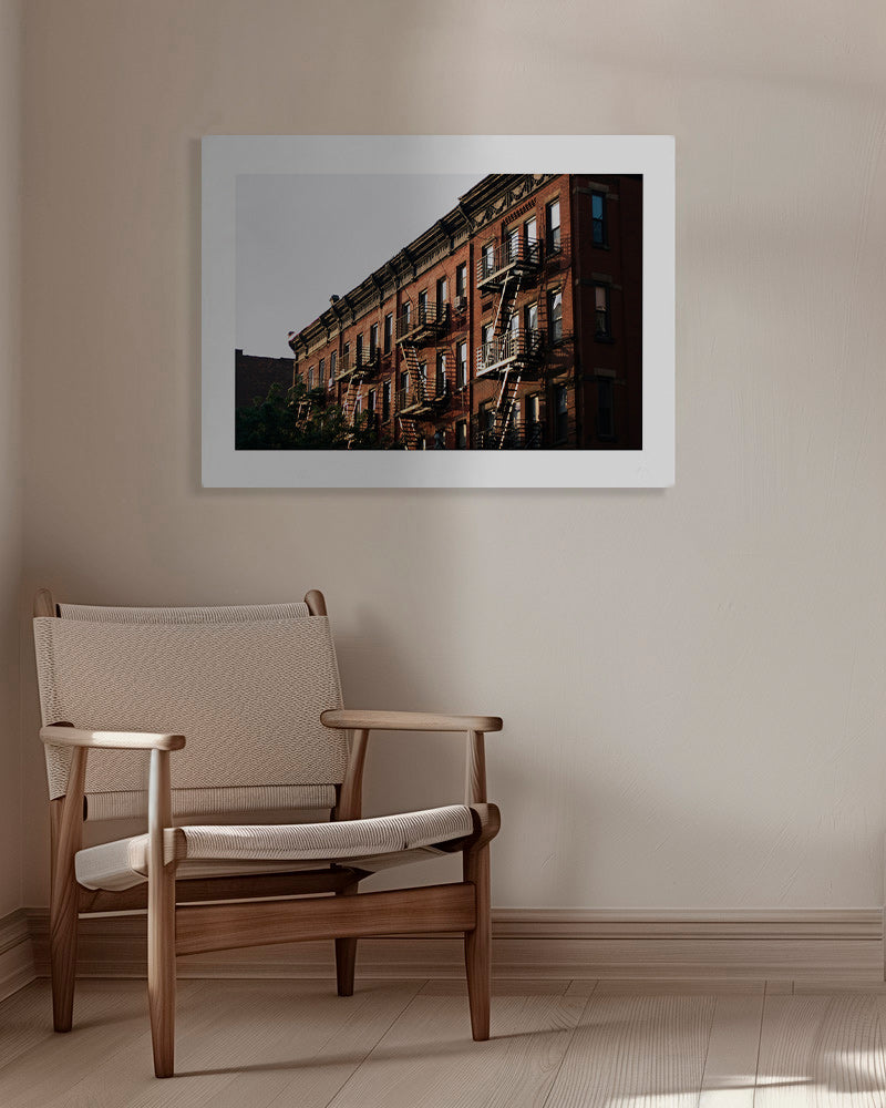 Travel poster: New York brownstone facade with fire escapes