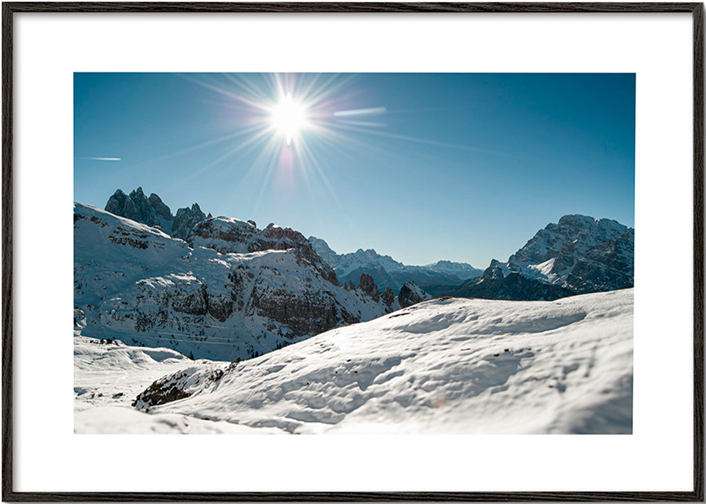 Landscape art: snowy mountain range under bright sun