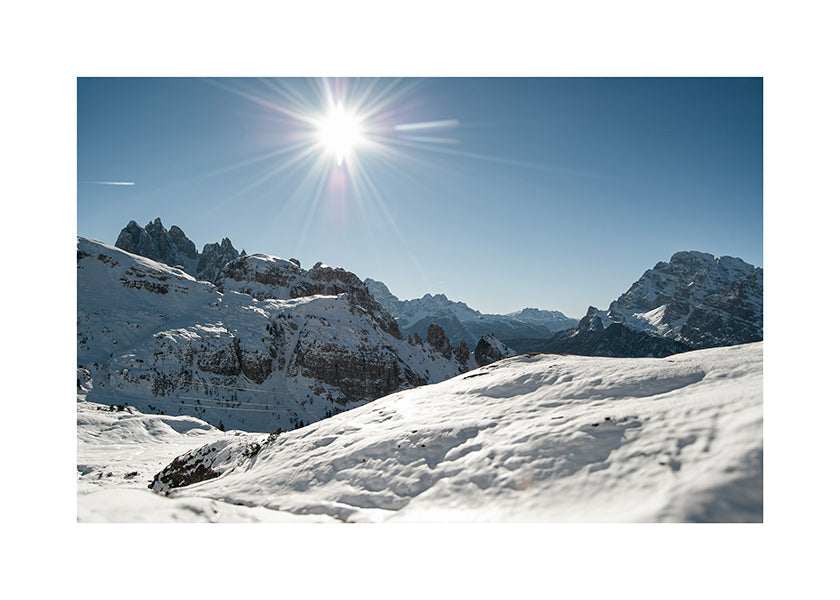 Landscape art: snowy mountain range under bright sun