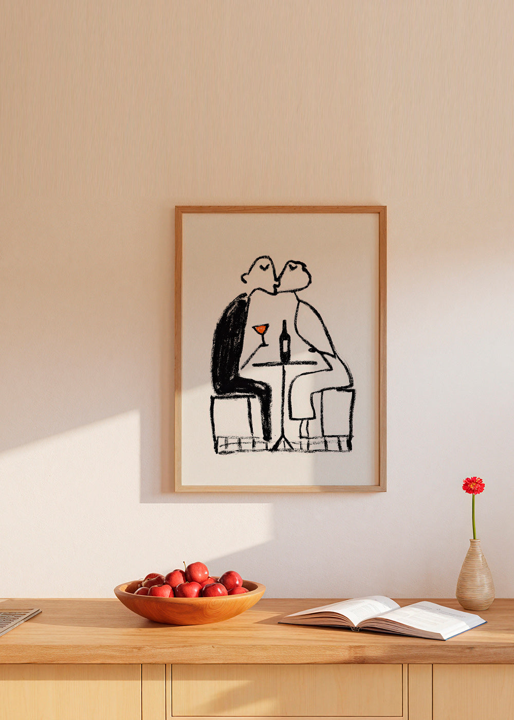 Kitchen art: couple sharing a wine