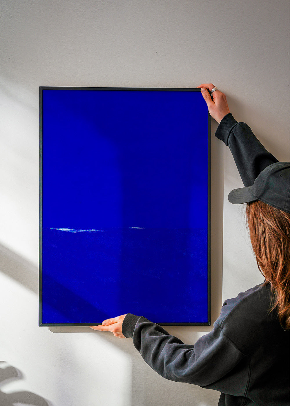 Blue abstract artwork with subtle horizon