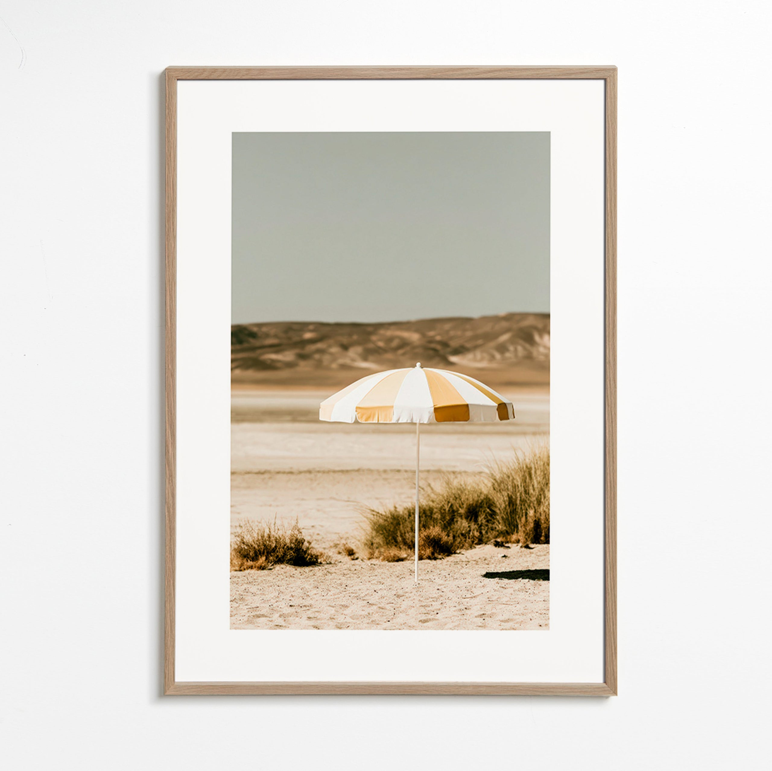 Landscape art with striped beach umbrella