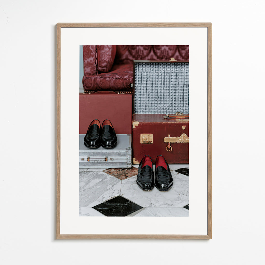 Travel poster with vintage trunks and polished loafers