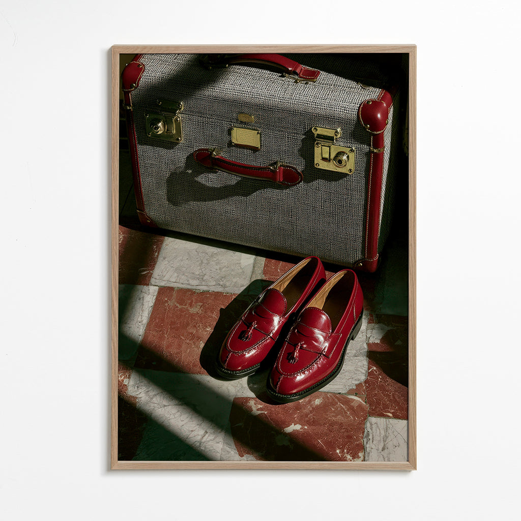 Travel photograph with vintage suitcase and red loafers