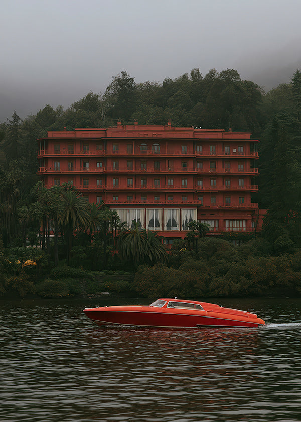 Landscape art: red hotel and speedboat