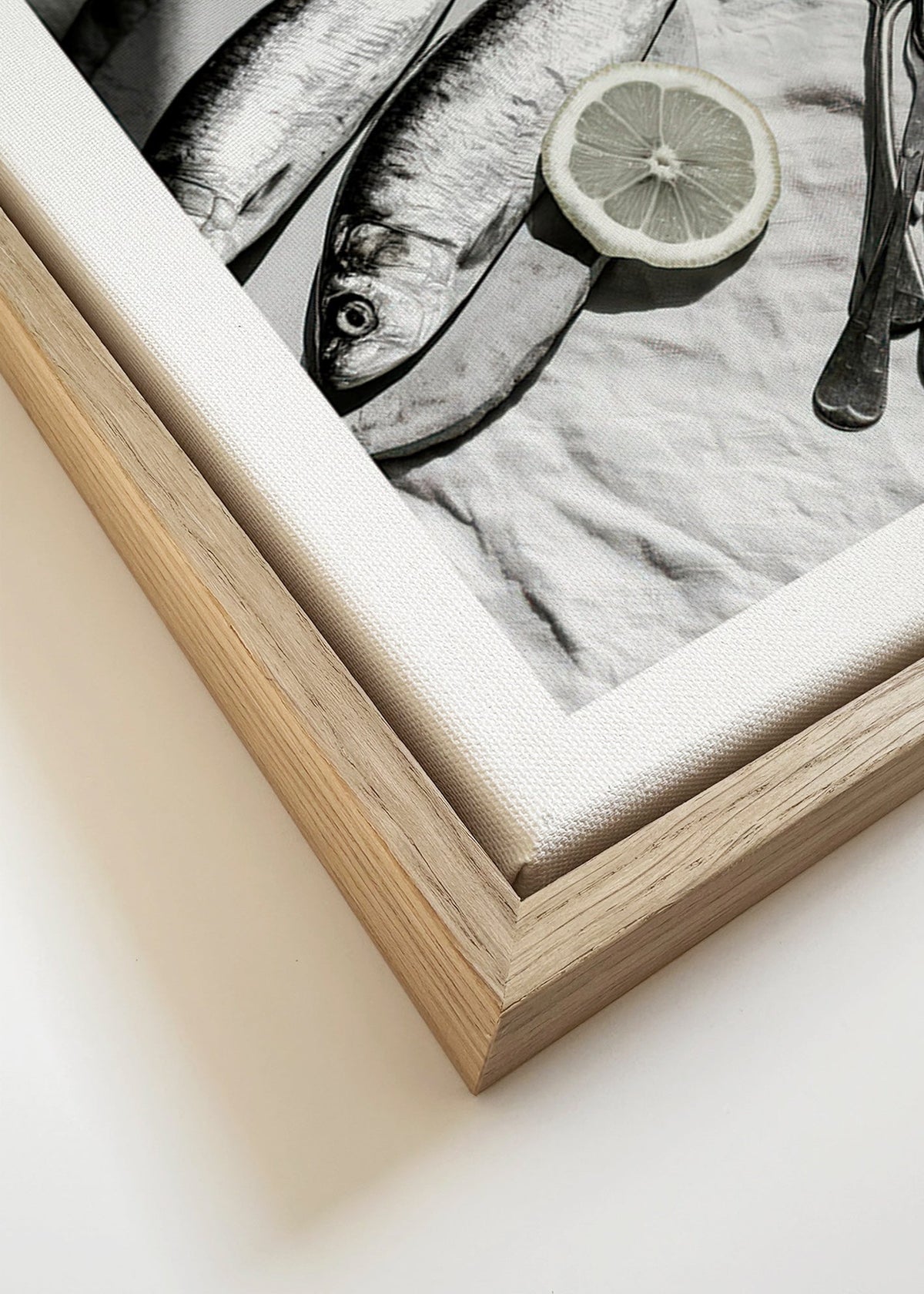 Kitchen art: monochrome sardines and lemon still life