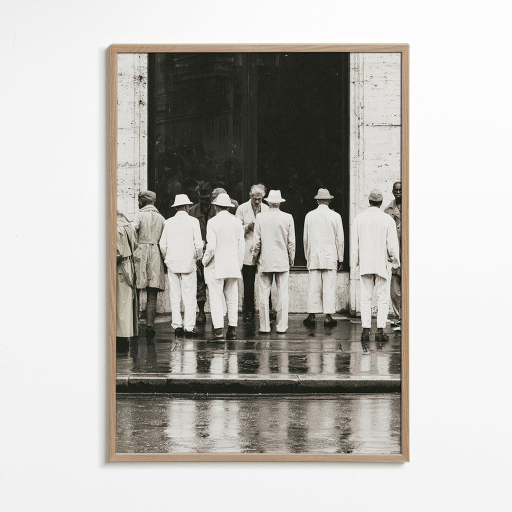 Black and white photo of men from the back in rain