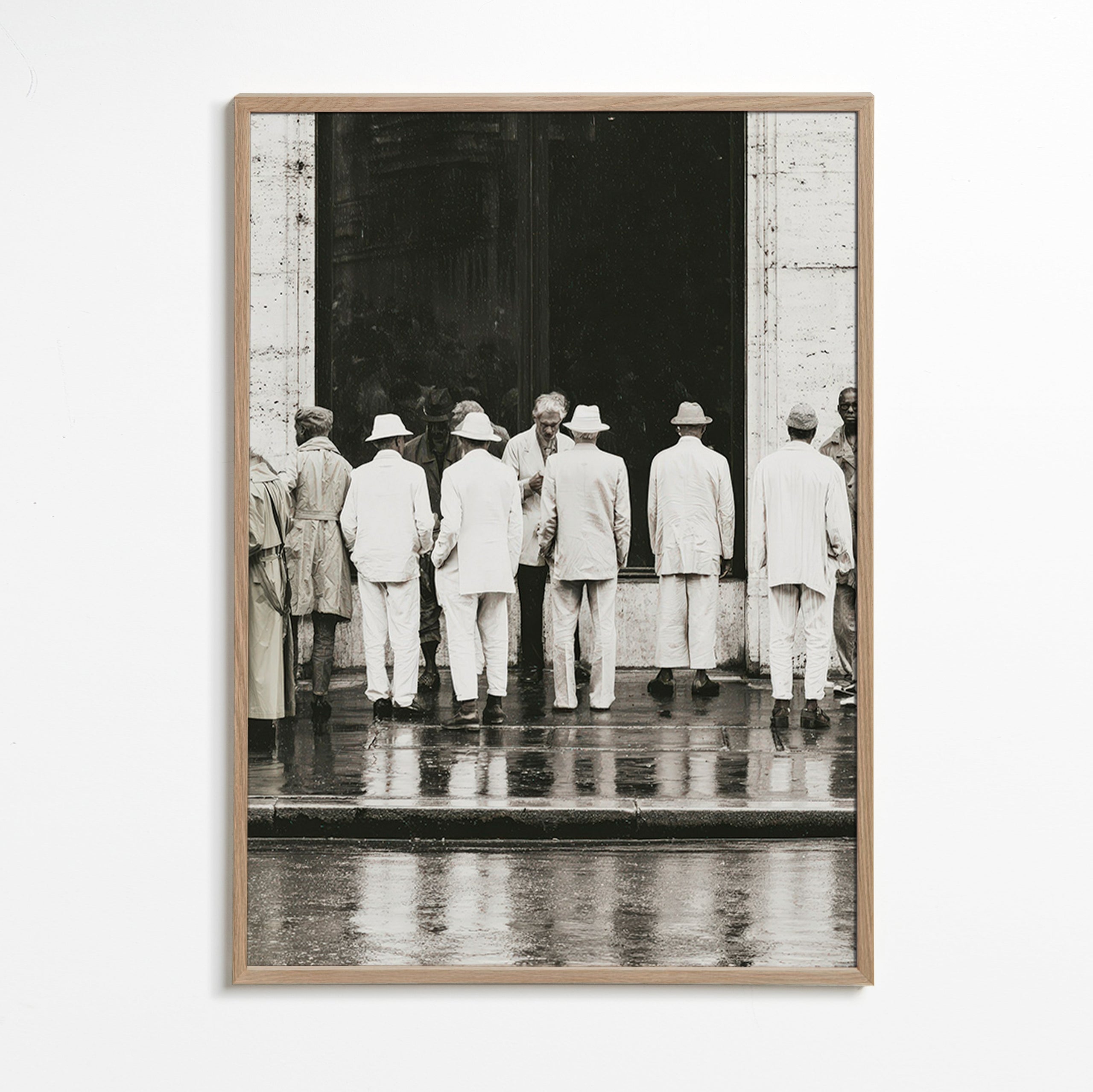 Black and white photo of men from the back in rain