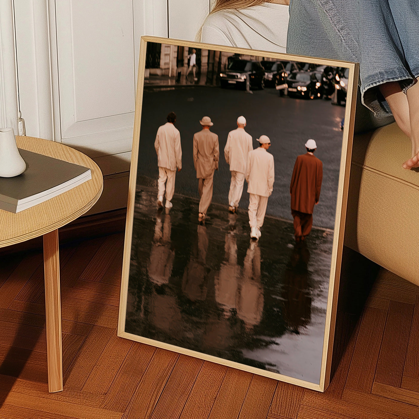 Photograph: five figures walking on a wet street