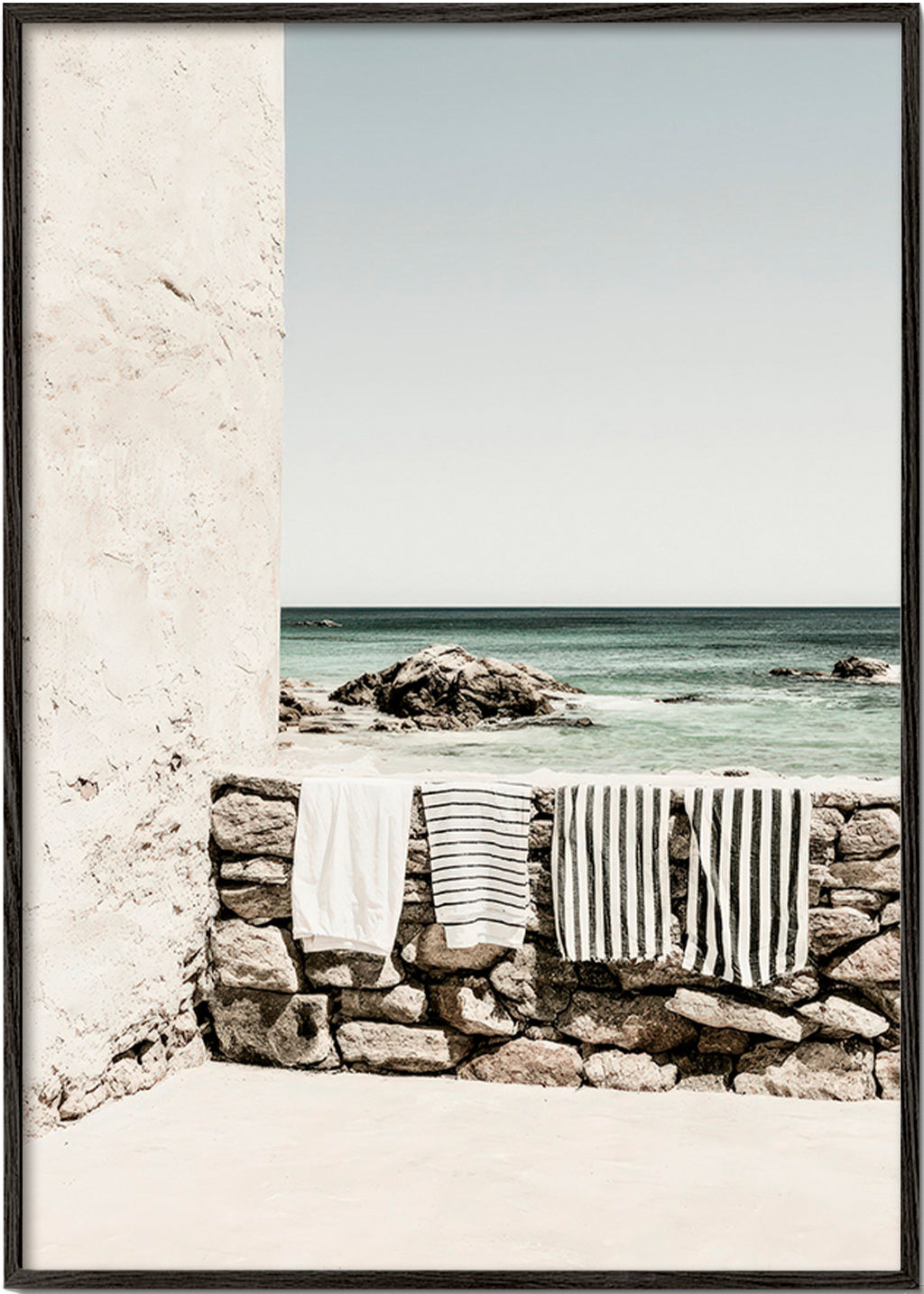 Coastal landscape photograph with hanging towels